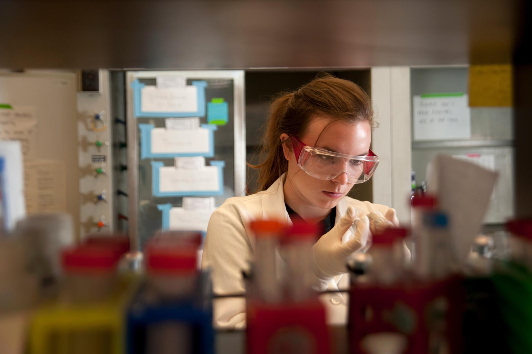 female student performing a PCR